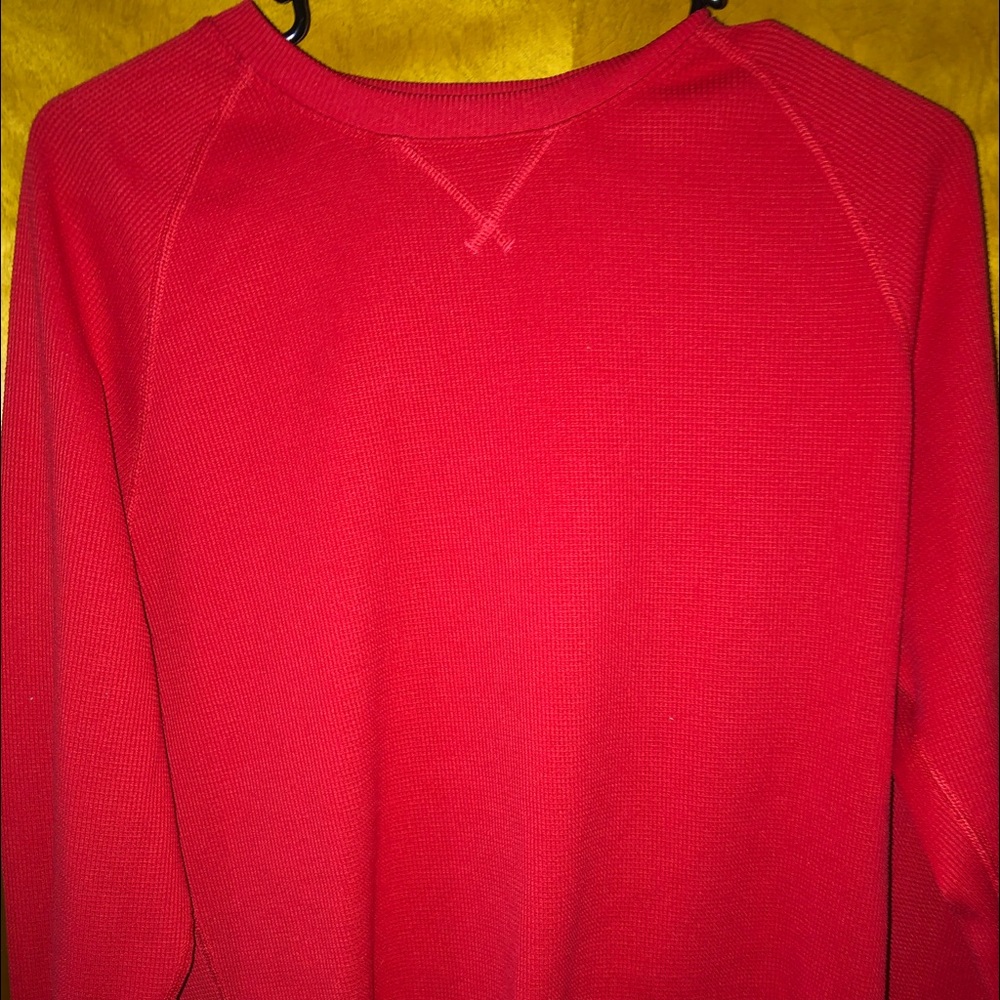 Men’s red long sleeve shirt.
